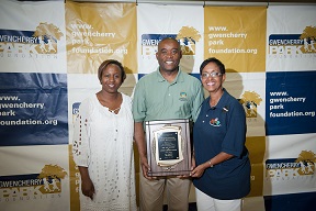 Commssioner Monestime receiving award