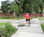 Biker crossing bike trail