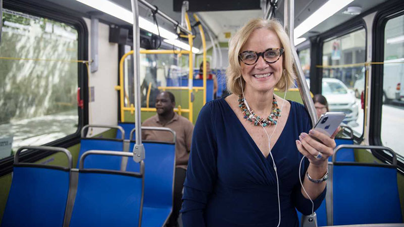 Commissioner Higgins riding the bus