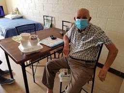 Male elderly resident wearing a face mask
