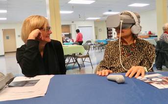 A senior wearing VR goggles