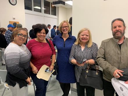 Commissioner Eileen Higgins, center, with small business owners at an event certifying her district’s Mom and Pop small business grants