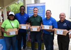 Commissioner Rene Garcia with other agencies distributing hurricane emergency meal kits