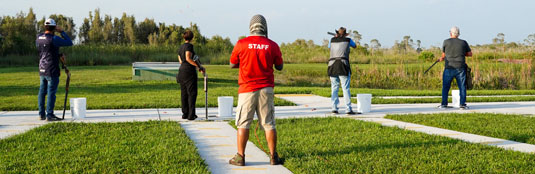 A shooting club - four shooters and one instructor - at Trail Glades Range.