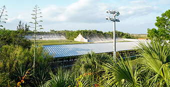 A man at Trail Glades Range shooting at a target.