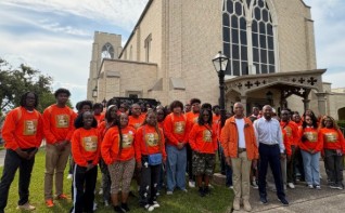 Commissioner Oliver G. Gilbert, III with high school students