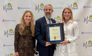 Commissioner Vicky L. Lopez presenting certificates of appreciation