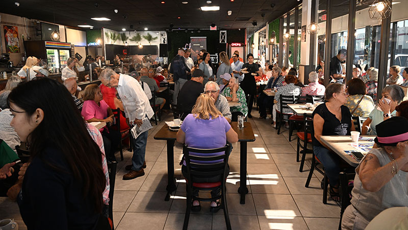 People eating indoors at a restaurant.