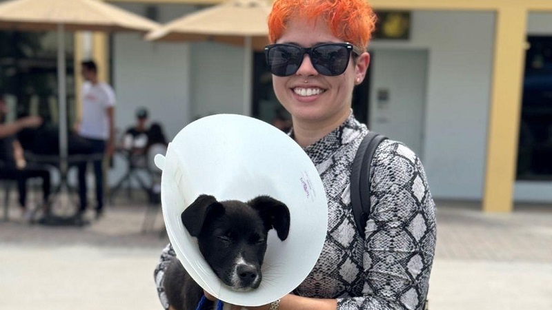 Young woman with her new adopted dog.
