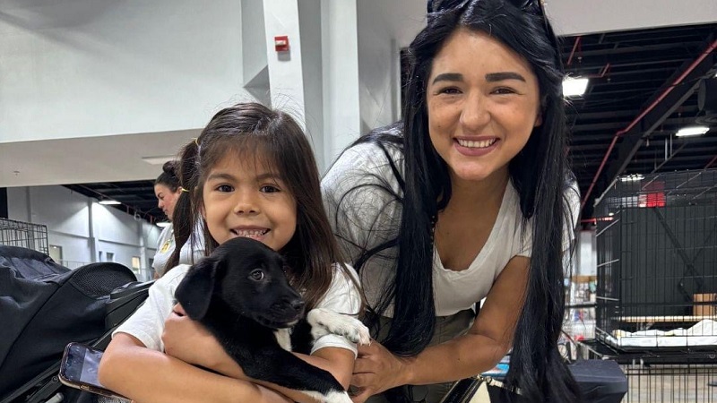 Mother and daughter at pet adoption event. 