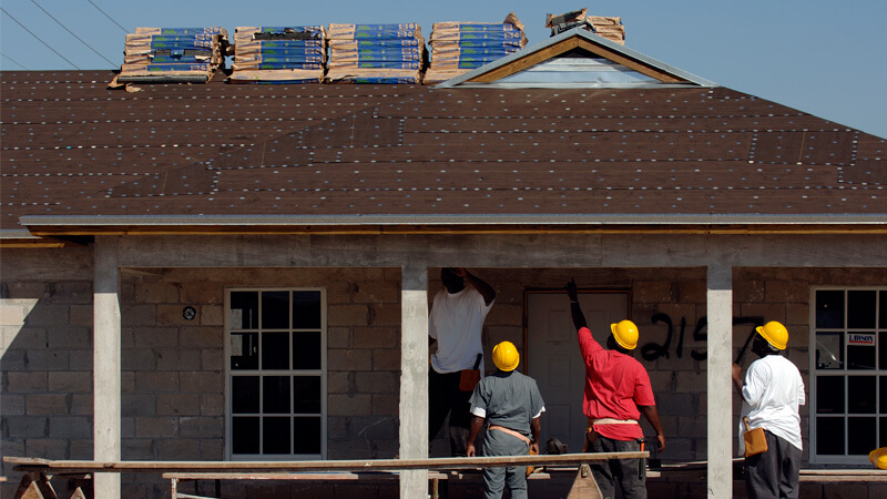 Workers building a house 