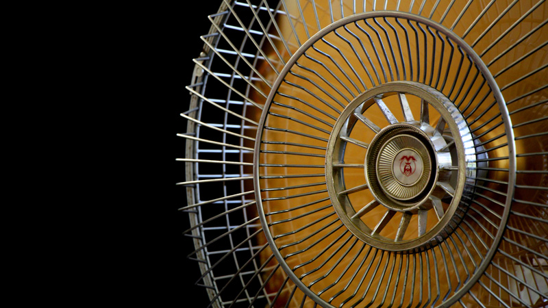 a mechanical fan unit, shiny and chrome on a white background
