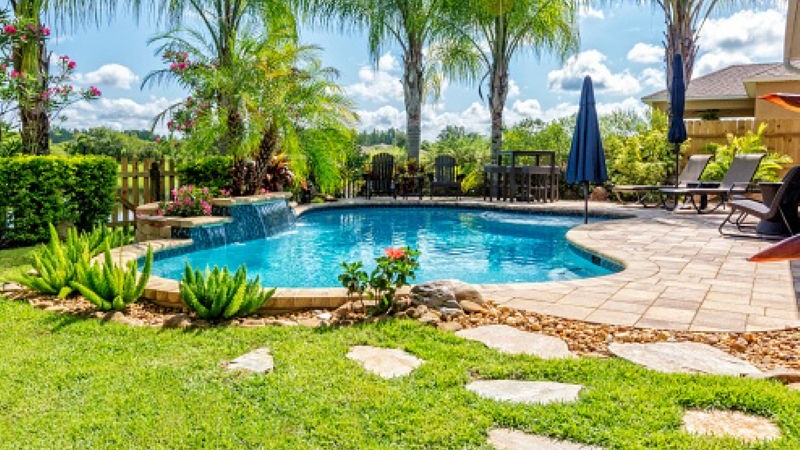 image of a free form pool with pavers surrounding it