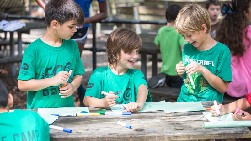 Kids in summer camp doing arts & crafts 