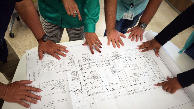 image of engineers reviewing plans