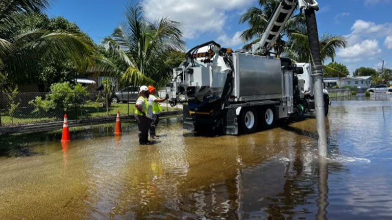 WASD workers clearing out flood waters