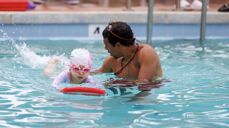Girl learning to swim.
