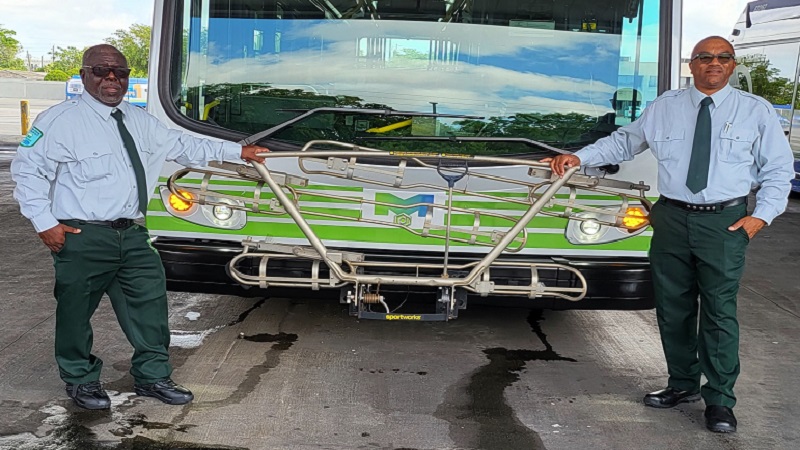 Lane and Brown in front of bus