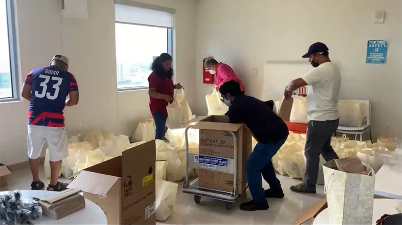 ITD team members preparing bags for food drive