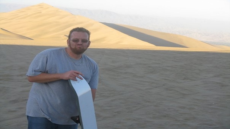 Eric Streett sandboarding at Huacachina, Peru.