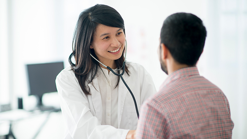 doctor checking on a patient