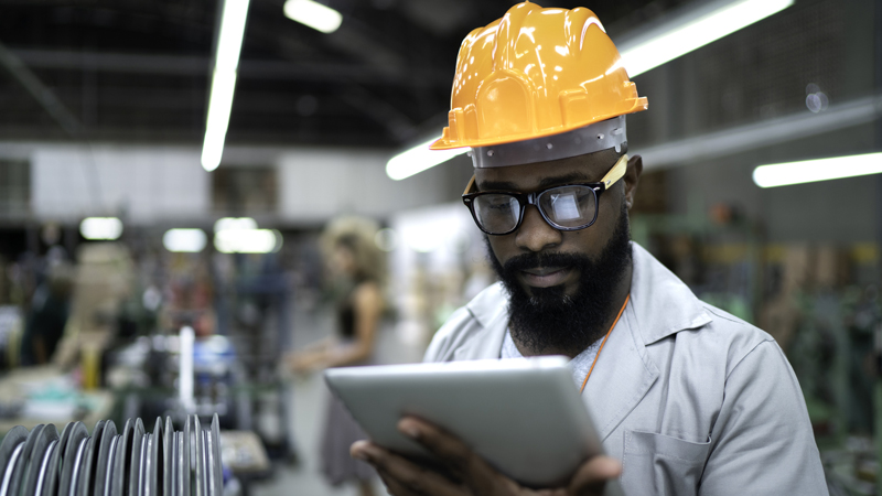 Image of an engineer holding a tablet.