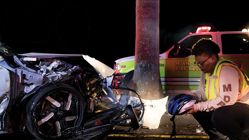 MDPD officer sitting in front of crashed car. Links to news item.