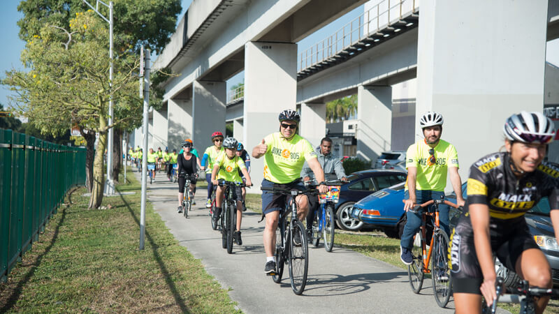 Men and women riding bikes.