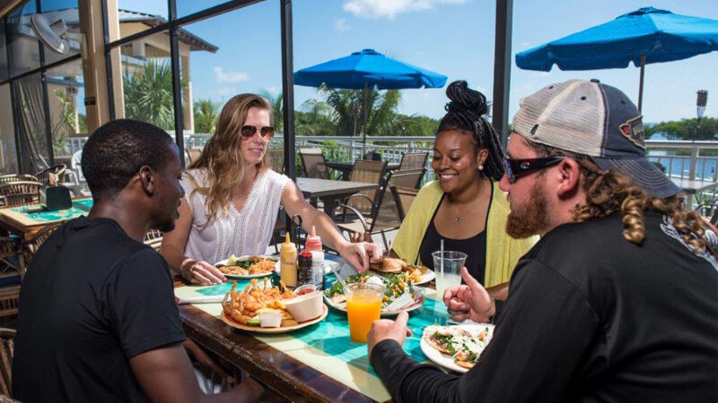 Friends eating in La Playa Grill.