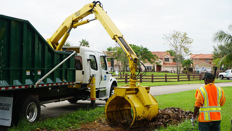 Truck collecting post-storm debris