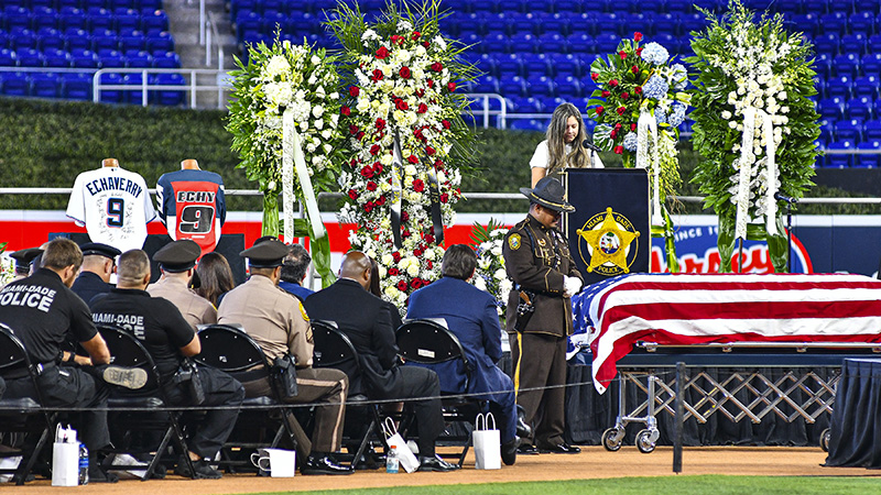 flag-draped casket of Miami-Dade Police Department Detective Cesar “Echy” Echaverry