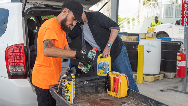 People dropping off chemical waste at the Chemical Drop-Off Mobile Event.