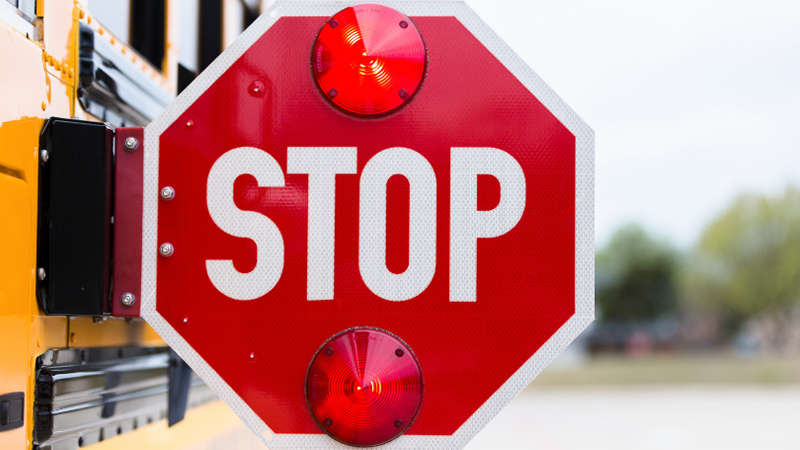 Extended school bus stop sign