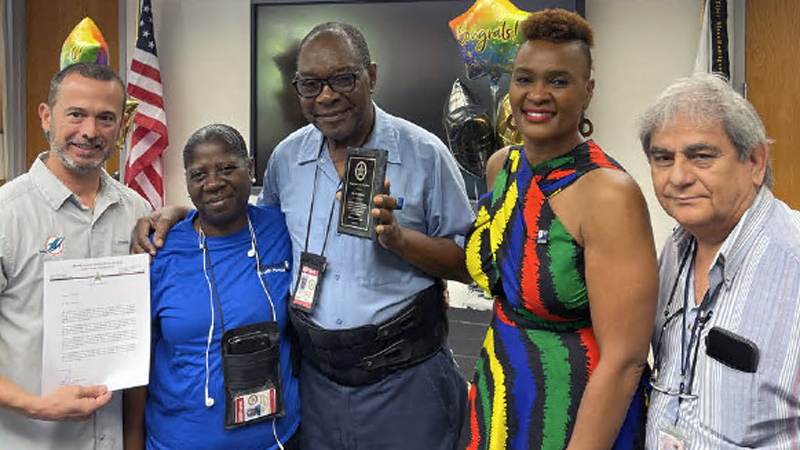 Goodwill employees and MDSO staff celebrate a retirement milestone together.