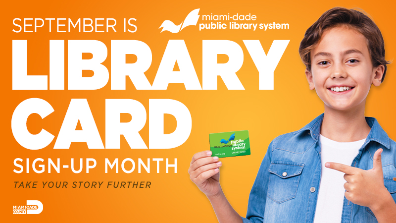 Boy holding Miami-Dade library card for September Sign-up Month.