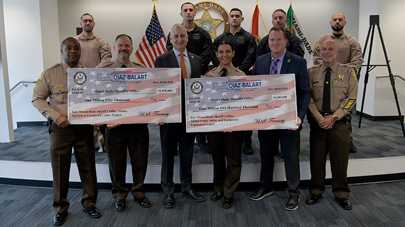 Officials and deputies display $5.25M funding checks at MDSO headquarters