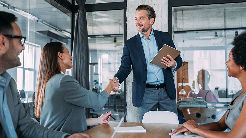business people shaking hands in an office