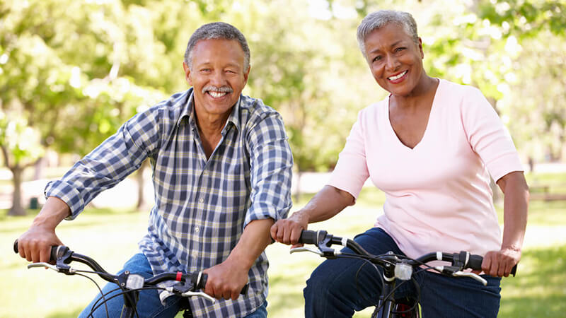 Couple riding bikes.