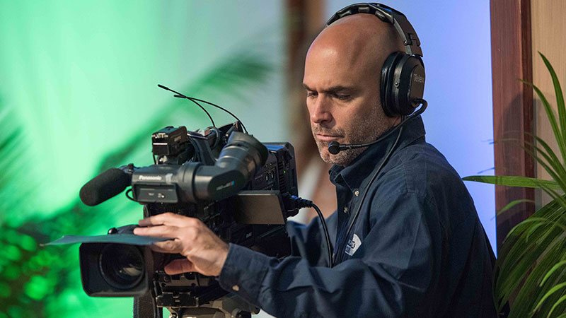 Male holding a film camera
