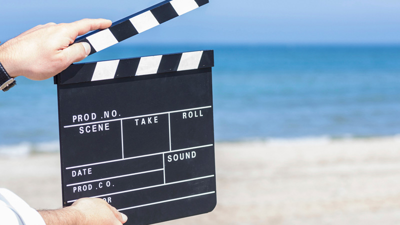 Filming a scene at the beach.