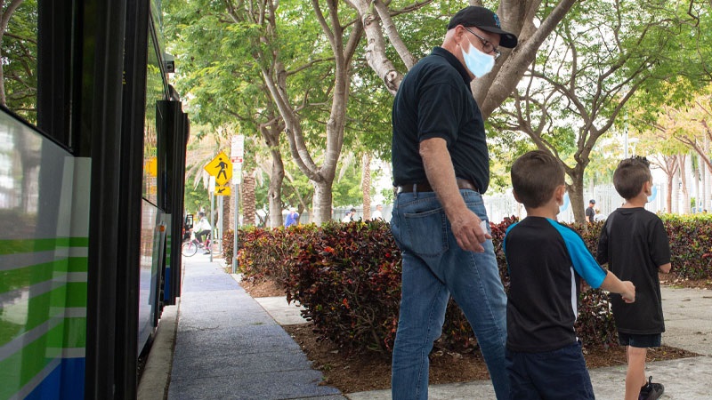 People exiting a Miami-Dade County bus