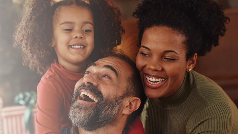 Smiling mom dad and daughter