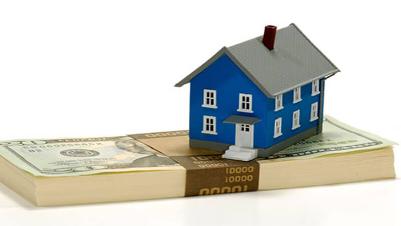An illustration of a house on top of cash.