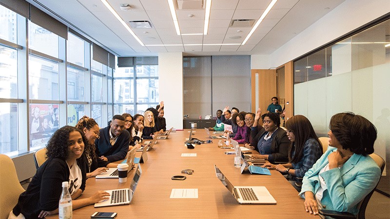 A group of attendees inside a conference room