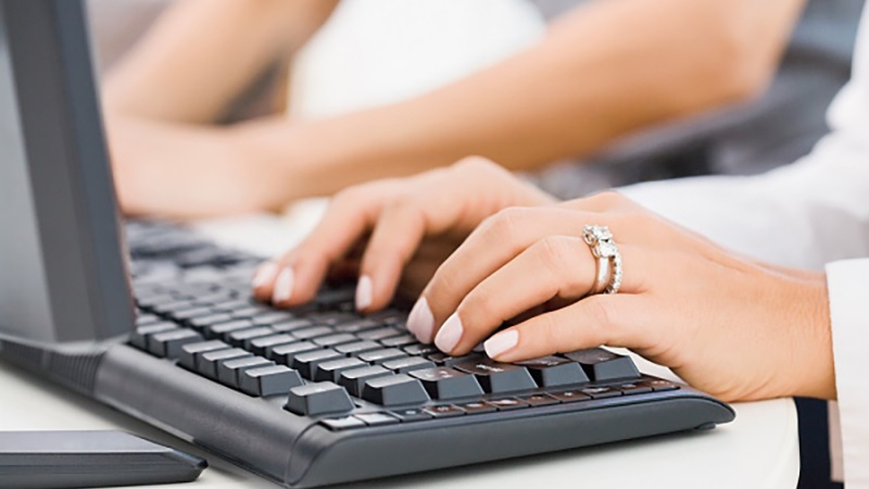 Woman typing on keyboard. 