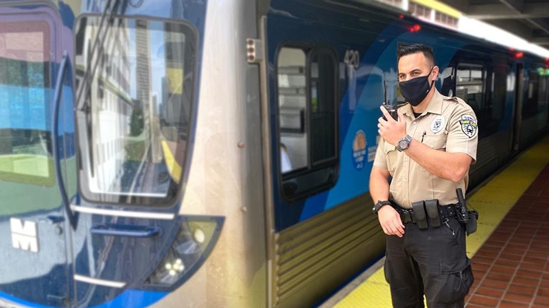 MDPD officer standing by the Metrorail 