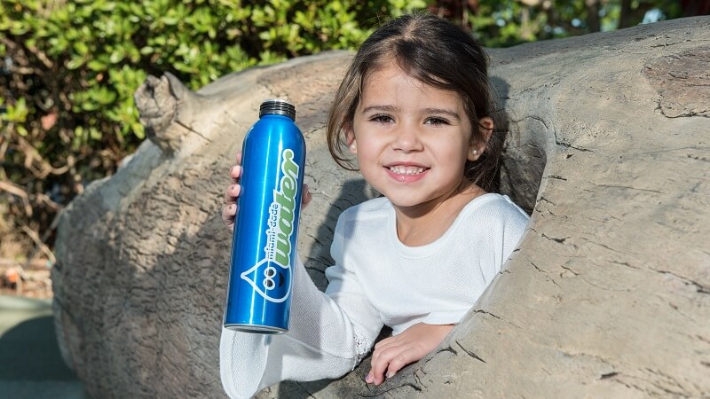 Girl holding water insulator.