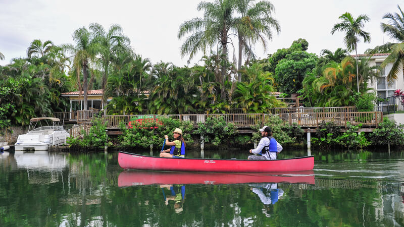 Woman and man canoeing.