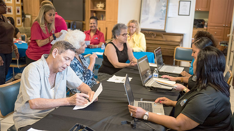 People being helped at a Community Resource Center.