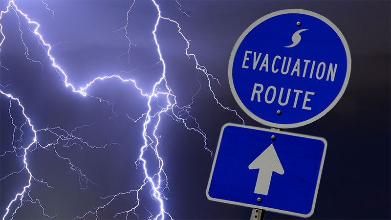 EVACUATION ROUTE street sign with a stormy background